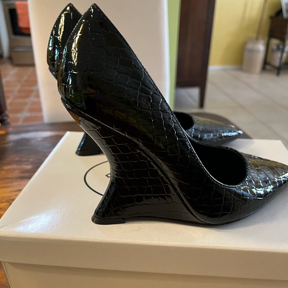 Steve Madden, Rival Black Crocodile Embossed Wedge Pumps
Approx. 4" heel height